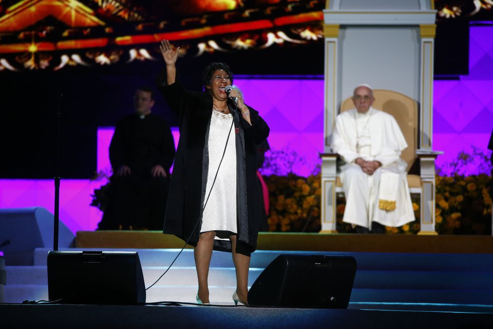 Pope Francis listens as singer Aretha Franklin performs as he attends the Festival of Families rally in Philadelphia