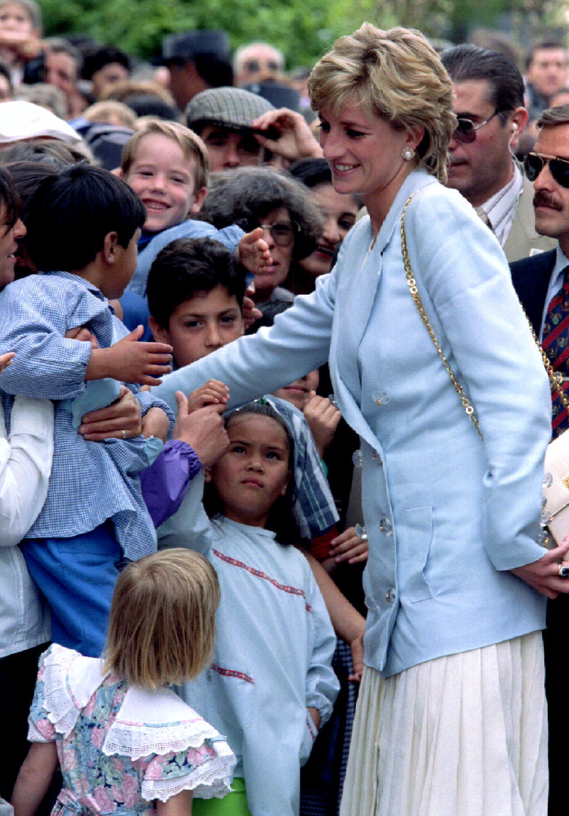 Princess Diana is greeted by children in the Welsh plaza of Gaiman, in the Argentine southern provin..