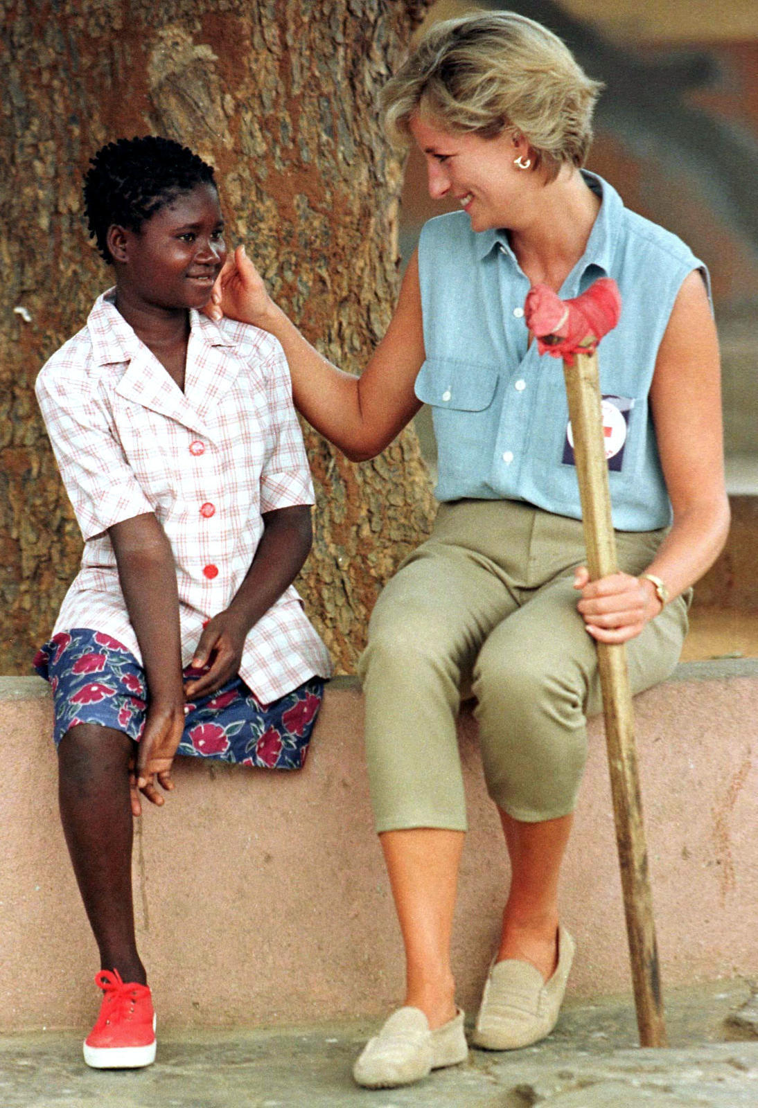 Diana, Princess of Wales, spends time with 11-year-old Sandra Tigica, (R) January 14, the youngest p..