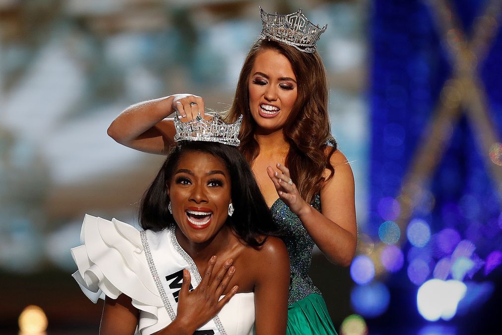 Miss New York Nia Imani Franklin has the tiara put on her by outgoing Miss America Cara Mund on stage in Atlantic City
