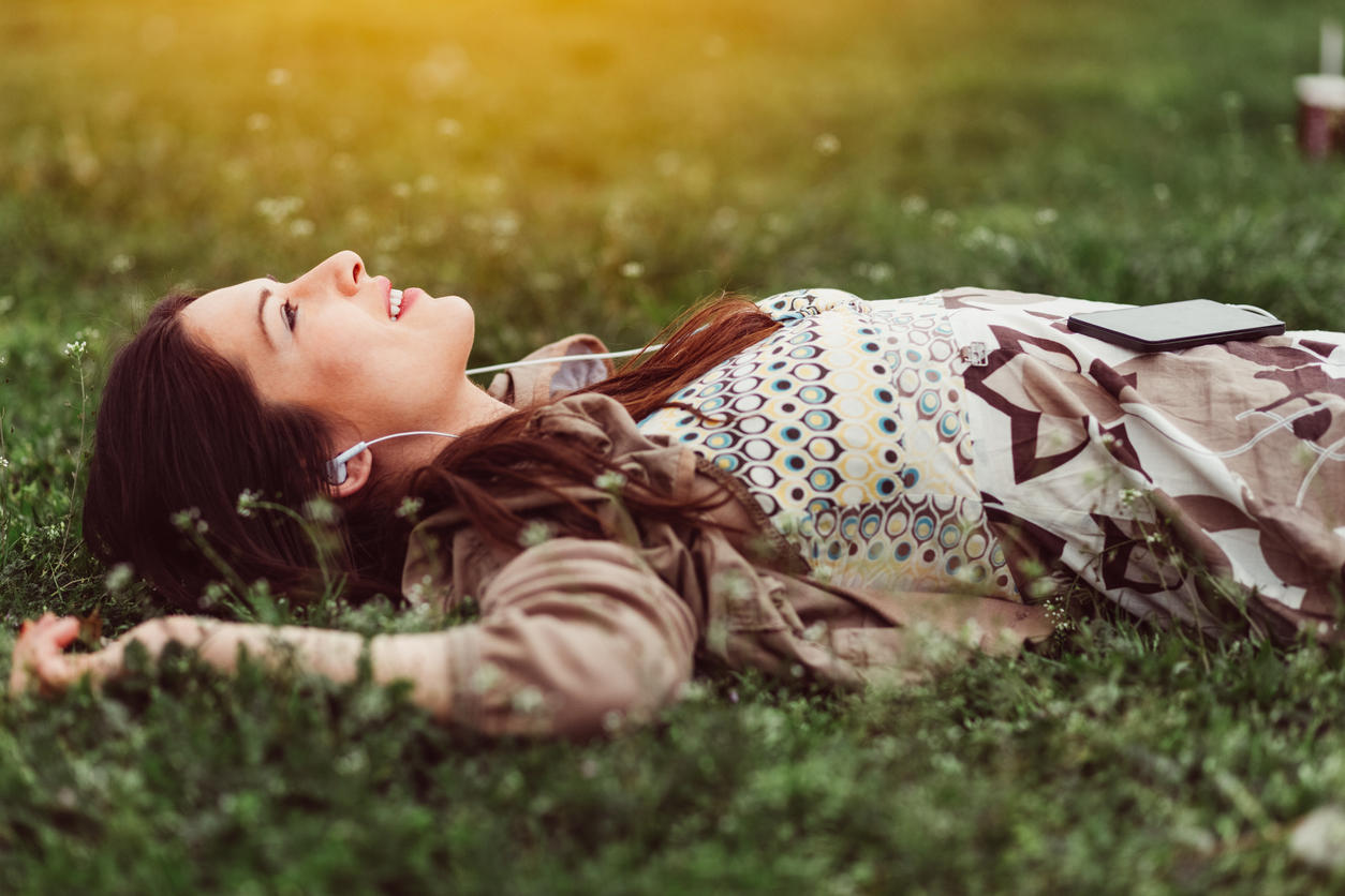 Dreamy woman in the grass