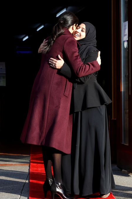 Britain’s Meghan, Duchess of Sussex embraces a woman after a visit to the Hubb Community Kitchen to see how funds raised by the ‘Together: Our Community’ cookbook are making a difference at Al Manaar, in London