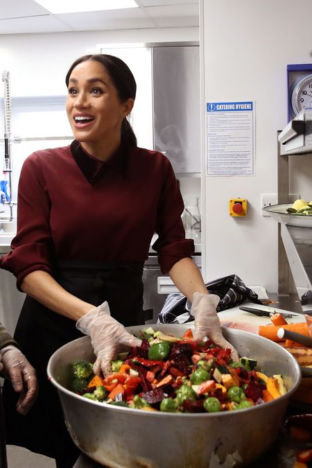 Britain’s Meghan, Duchess of Sussex visits the Hubb Community Kitchen to see how funds raised by the ‘Together: Our Community’ cookbook are making a difference at Al Manaar, in London