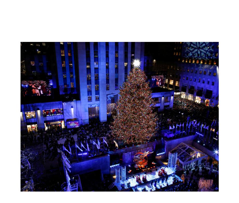 People watch the Christmas tree lighting at Rockefeller Center in the Manhattan borough of New York City, New York, U.S., November 28, 2018. REUTERSEduardo Munoz