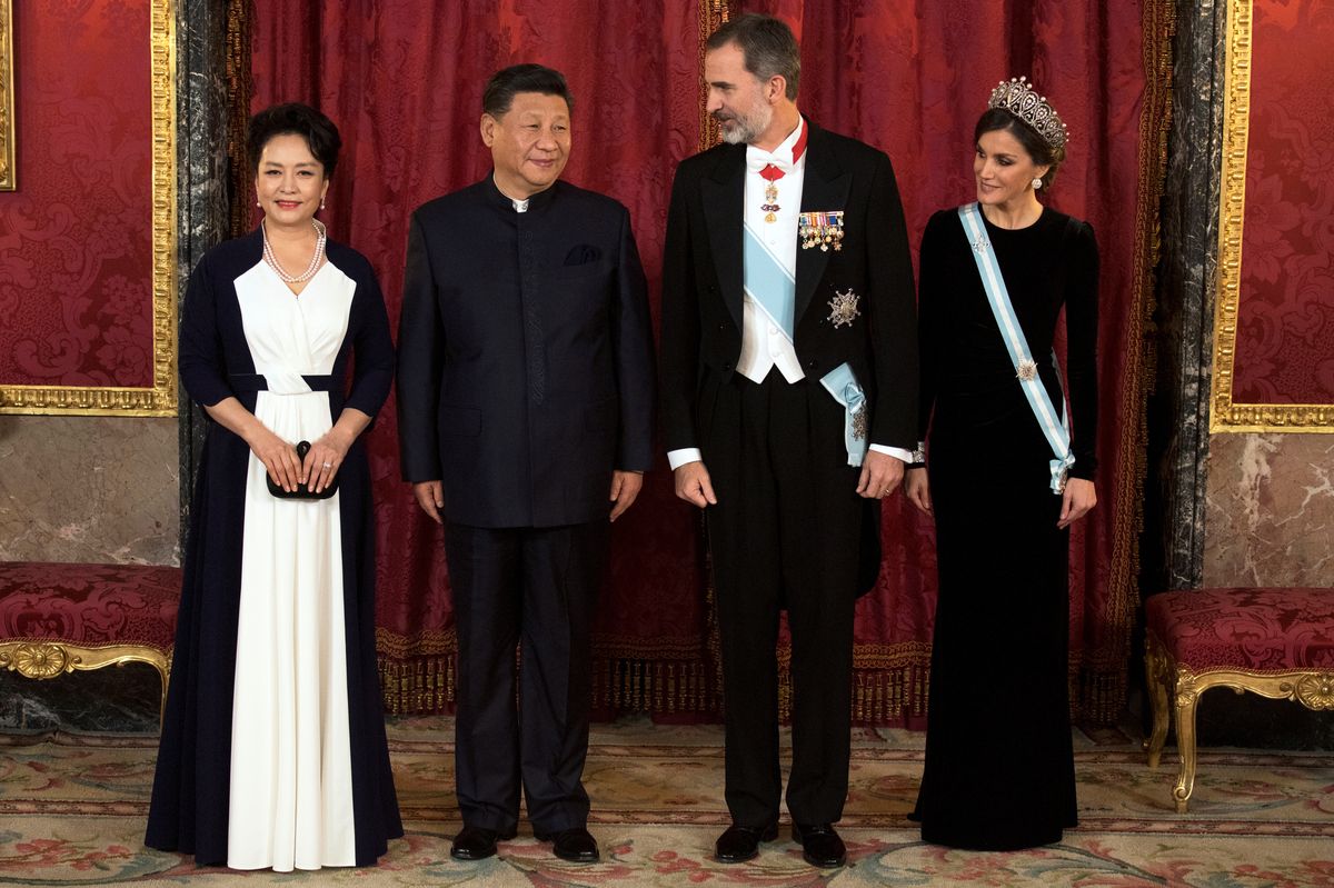 China’s President Xi Jinping and his wife Peng Liyuan pose with Spain’s King Felipe and Queen Letizia before a gala dinner at the Royal Palace in Madrid