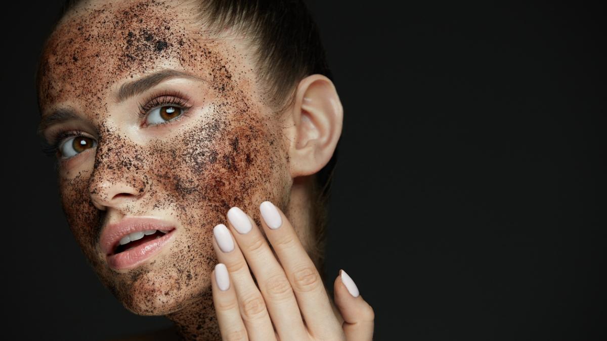 Face Care. Closeup Of Beautiful Woman With Coffee Scrub On Skin