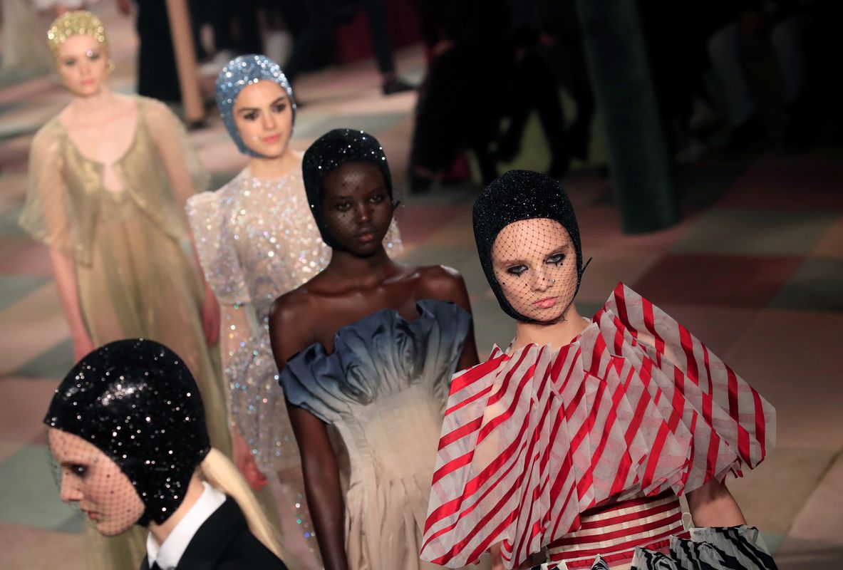 Models present creations by designer Maria Grazia Chiuri as part of her Haute Couture Spring-Summer 2019 collection show for fashion house Dior in Paris