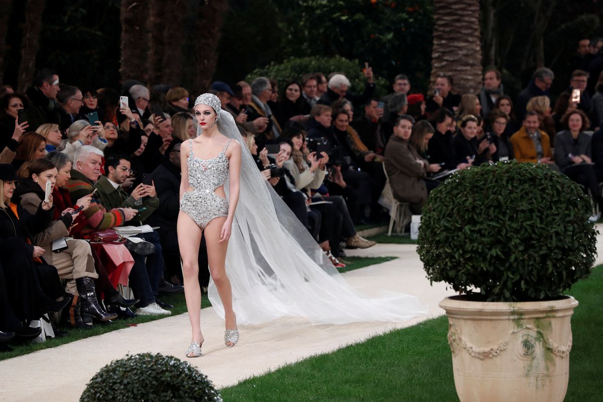 A model presents a creation by German designer Karl Lagerfeld as part of his Haute Couture Spring-Summer 2019 collection show for fashion house Chanel in Paris