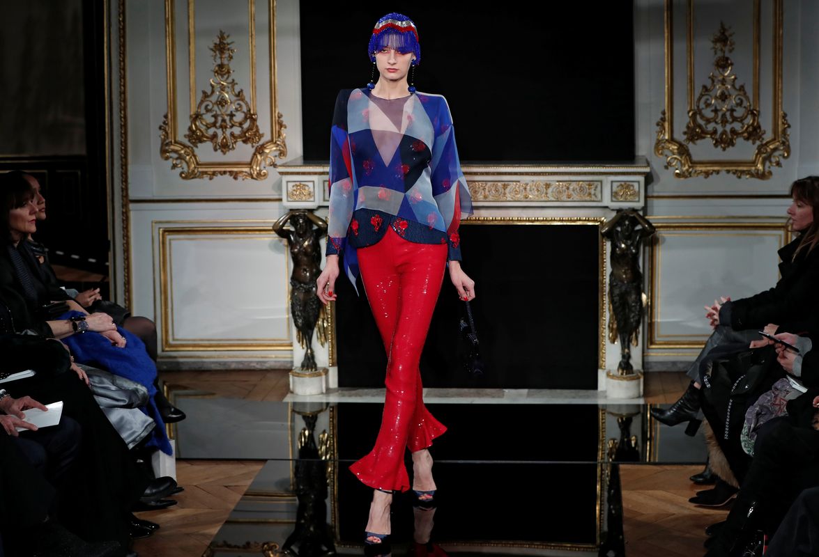 A model presents a creation by Italian designer Giorgio Armani as part of his Haute Couture Spring-Summer 2019 collection show for fashion house Giorgio Armani Prive in Paris
