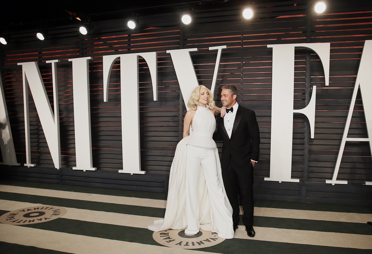 Singer Lady Gaga and her fiance Taylor Kinney arrive at the Vanity Fair Oscar Party in Beverly Hills, California