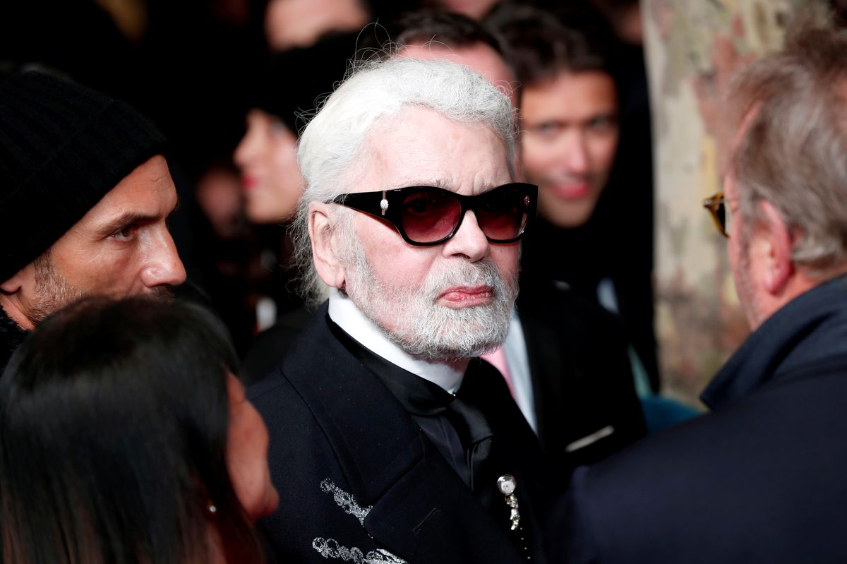 German designer Karl Lagerfeld arrives to attend the official switching on the Christmas lights on the Champs-Elysees avenue in Paris