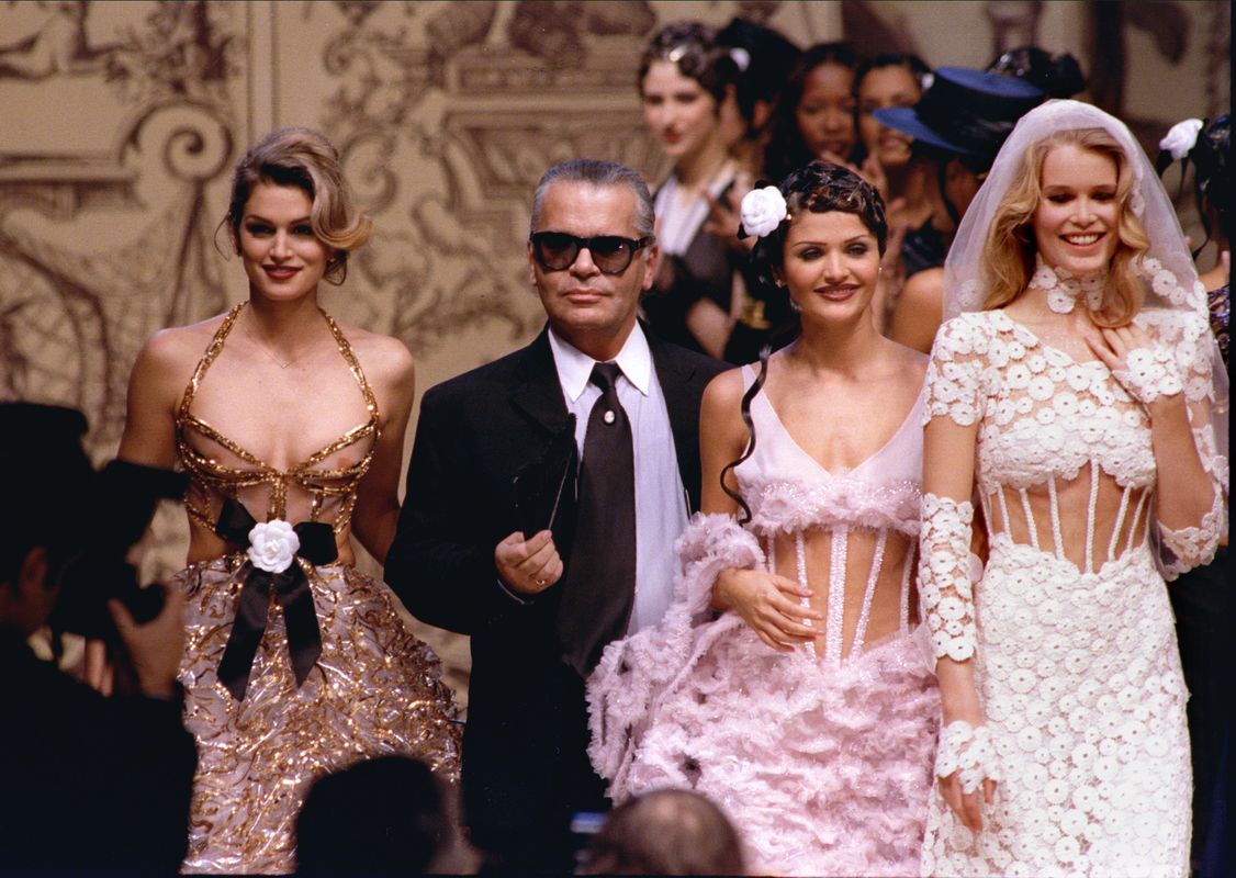 German designer for Chanel fashion house Karl Lagerfeld is surrounded by top models (L-R) American C..