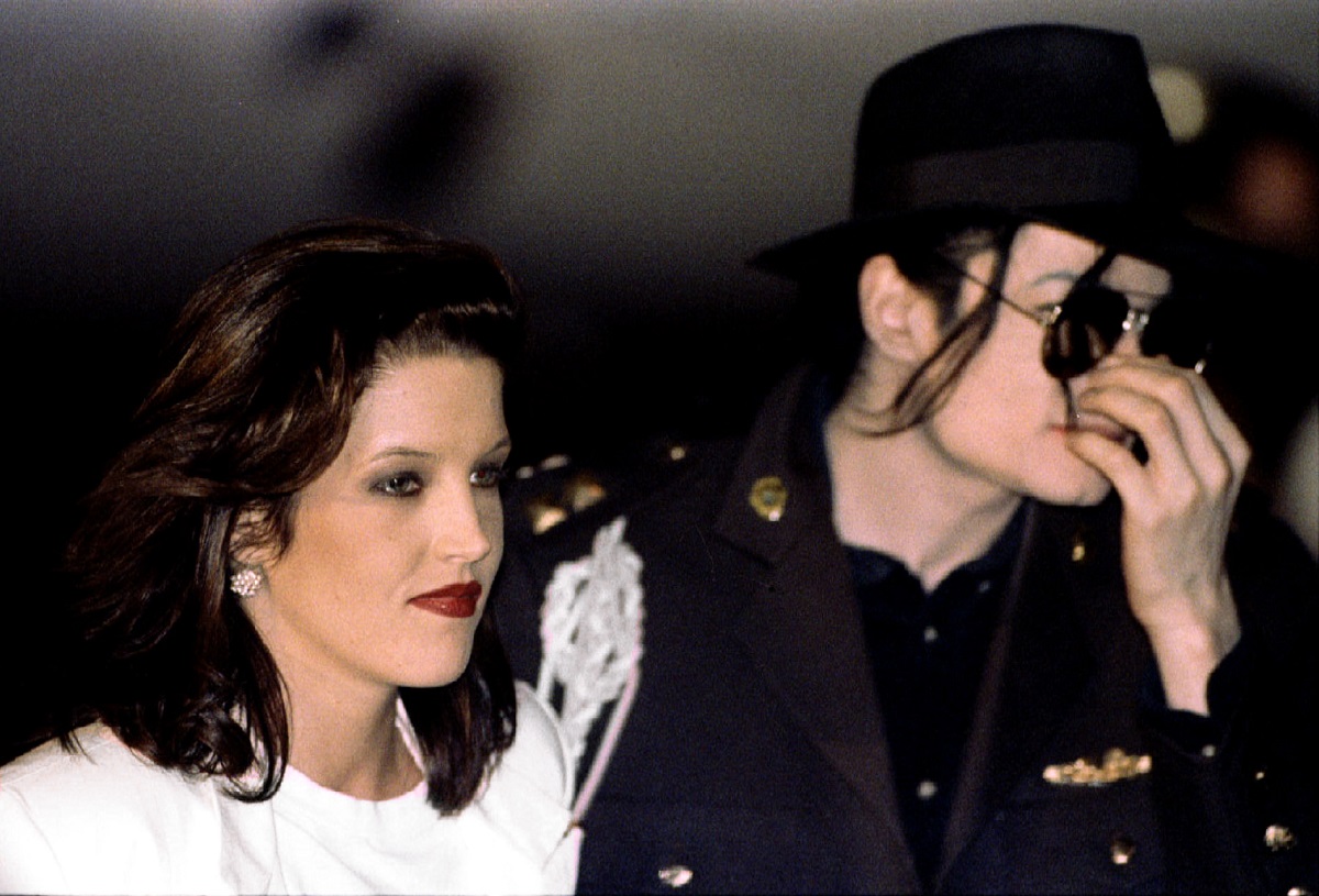 Popstar Michael Jackson and his bride Lisa Marie Presley-jackson leave their private airplane at Bud..