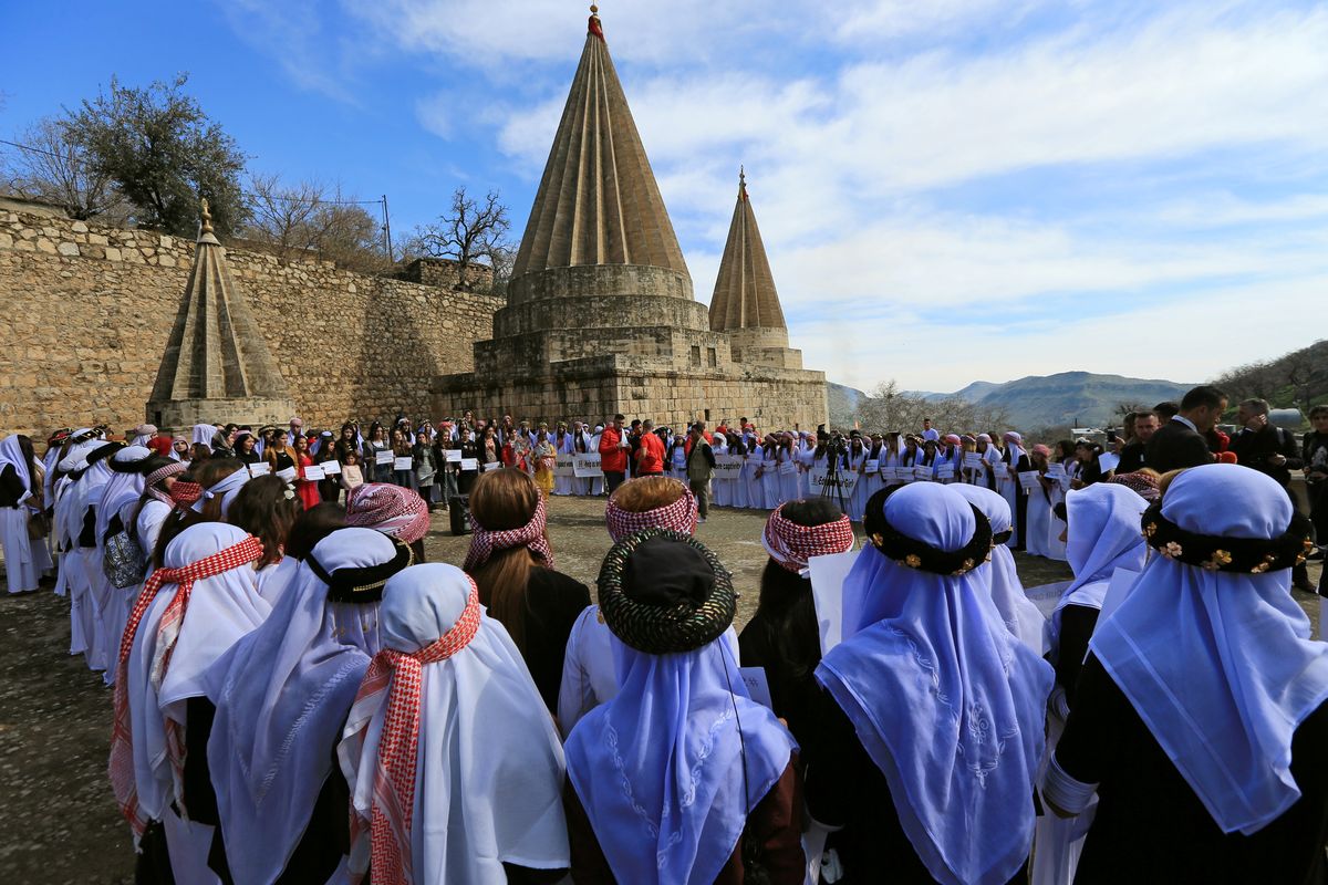 Yazidi’s women attend a ceremony at Lilash Temple to commemorate the death of women who were killed by Islamic State militants, during the International Women Day, in Shikhan