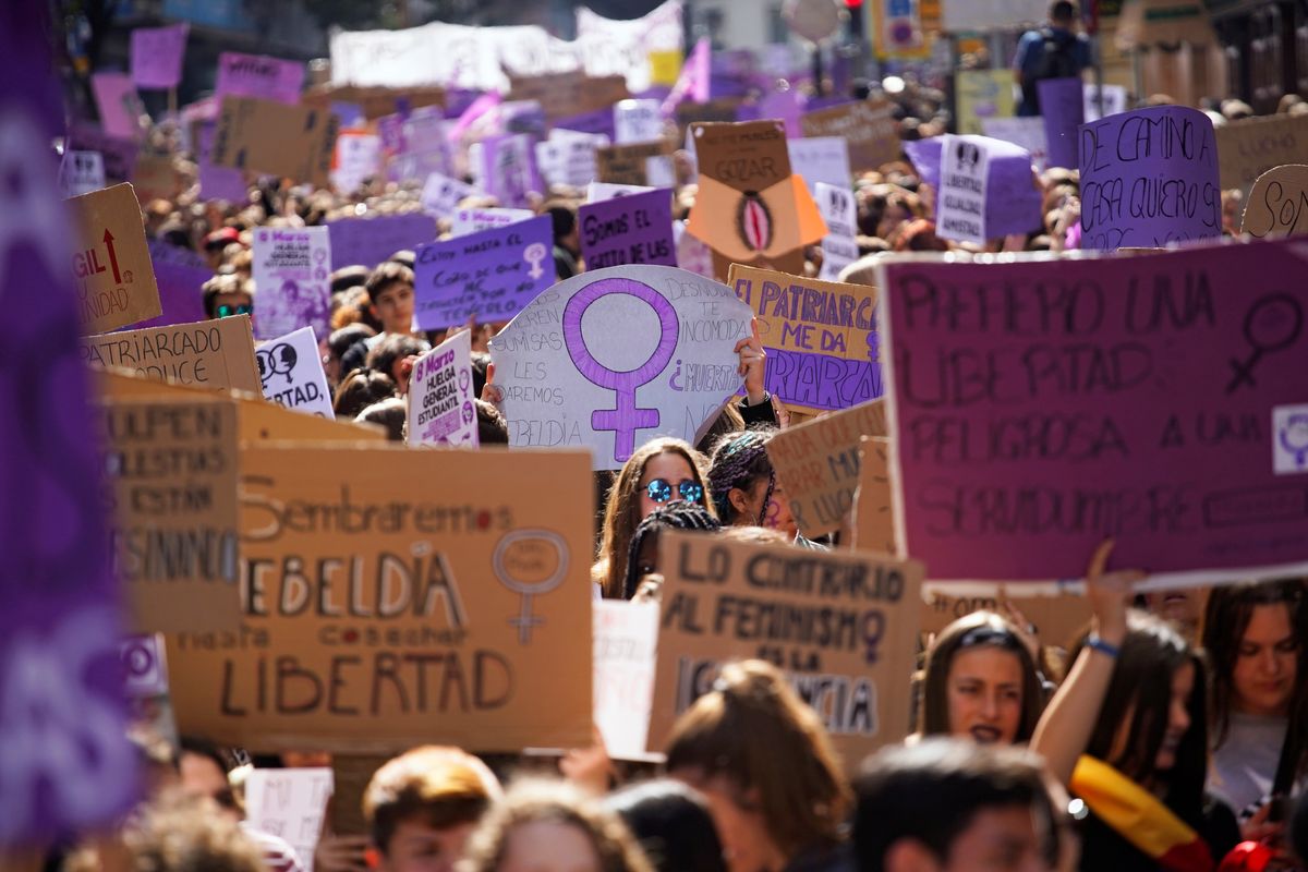 People take part in a protest during a nationwide feminist strike on International Women’s Day in Madrid