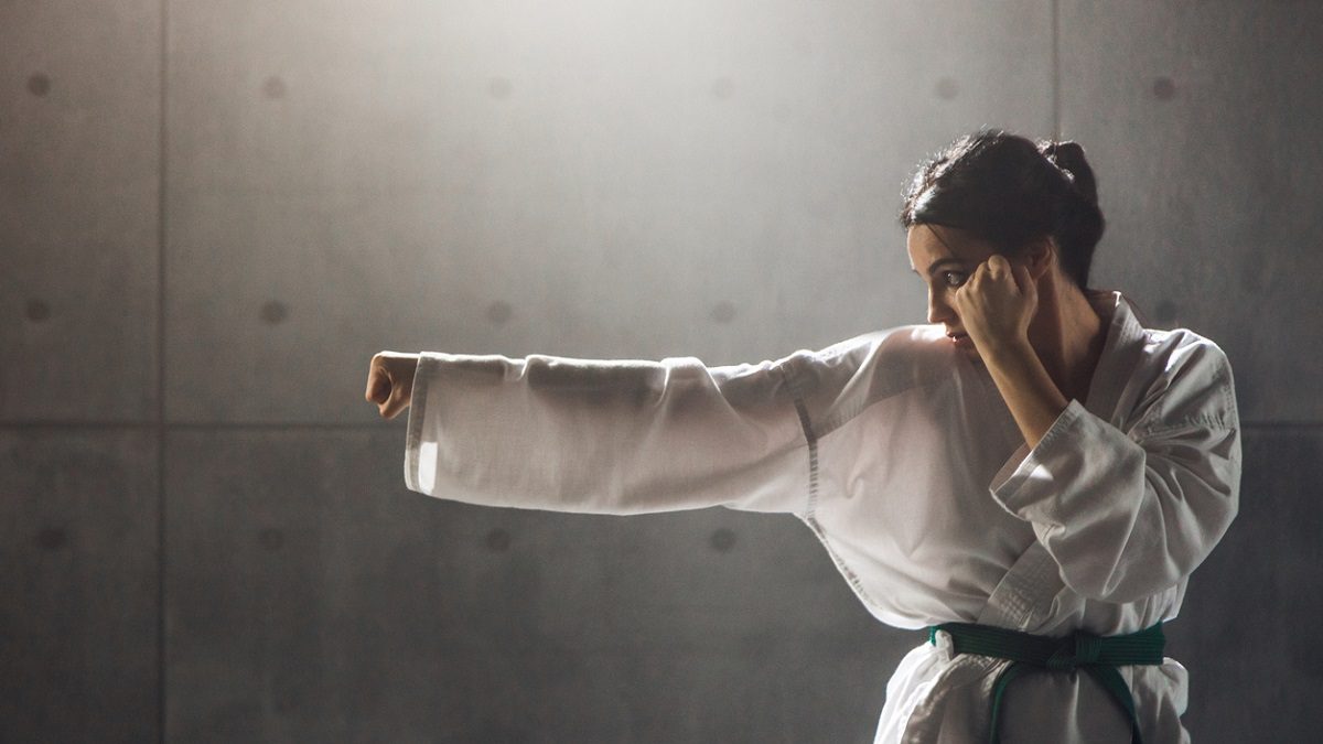 Woman in kimono practicing karate