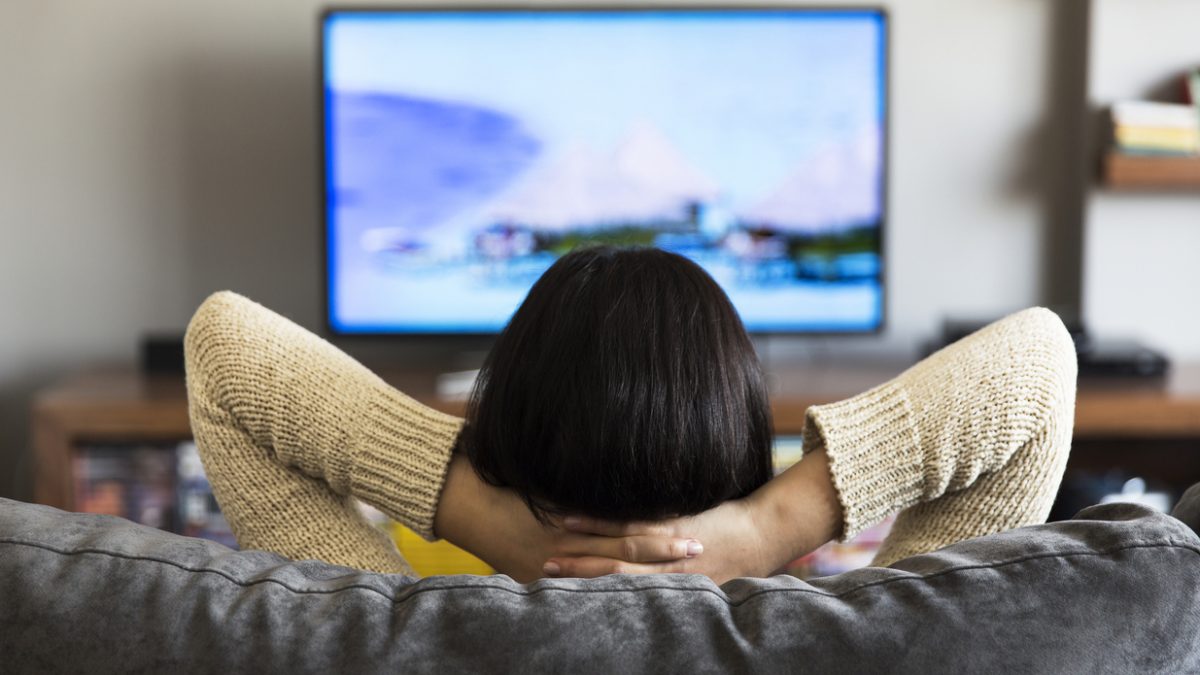 young woman watching television