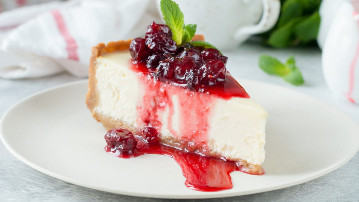 Delicious New York Cheesecake with berry sauce