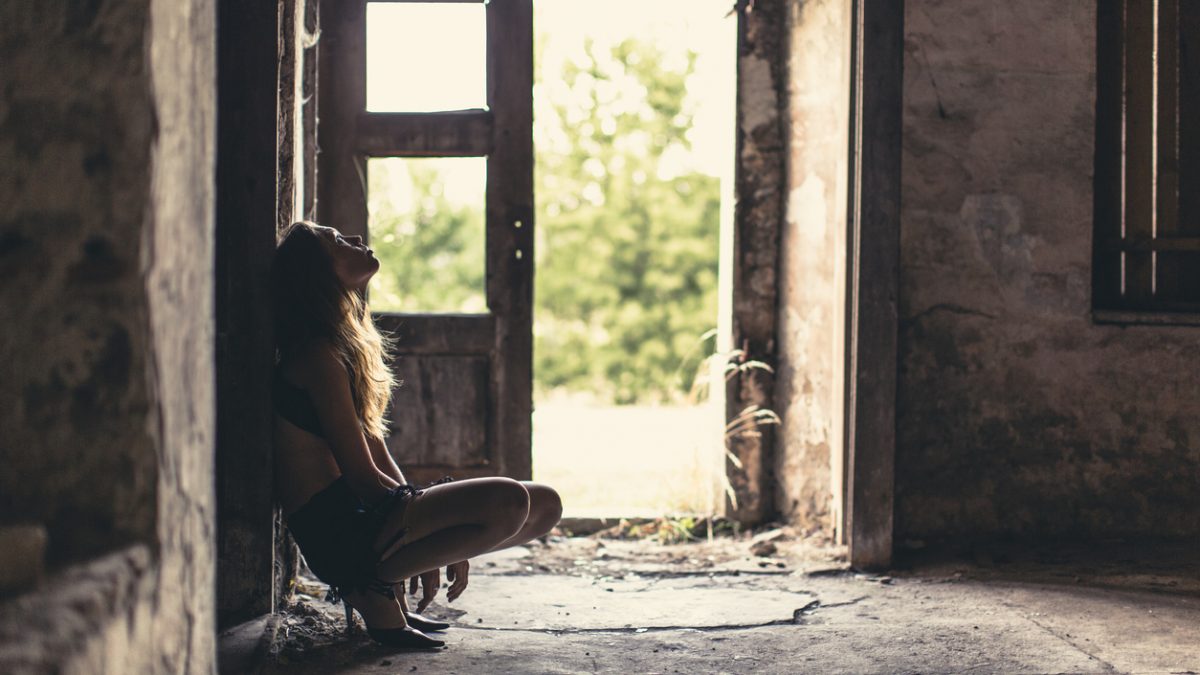Depressed runaway teenager in old house