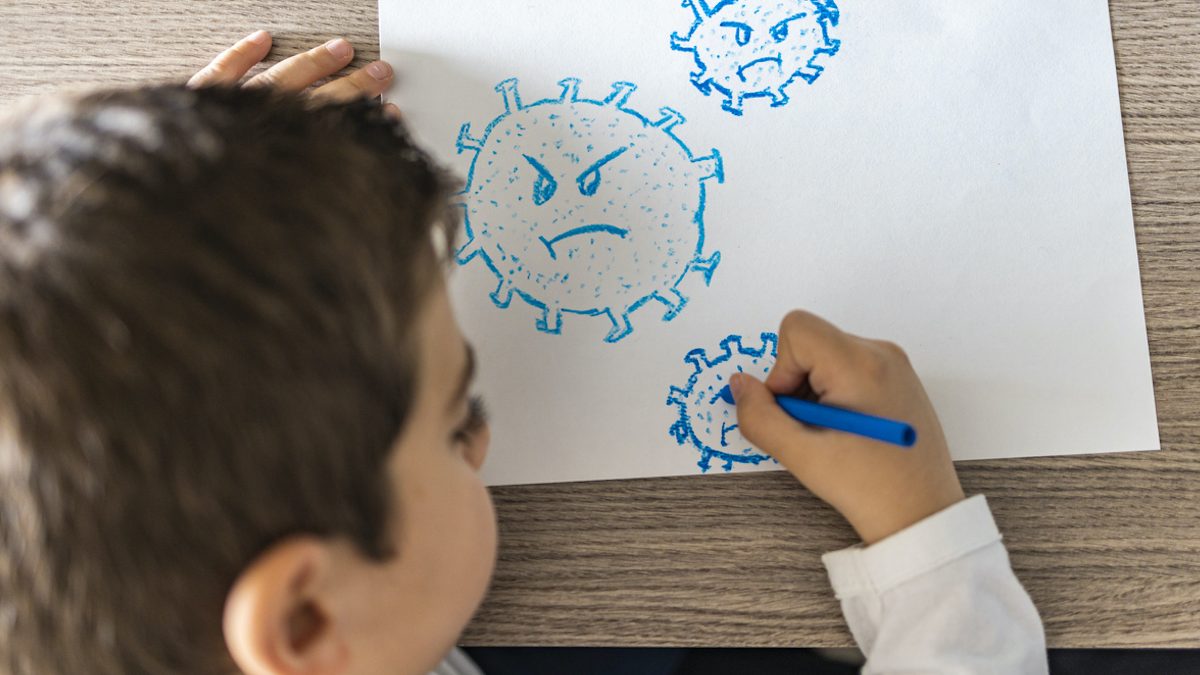 Little kid drawing a coronavirus