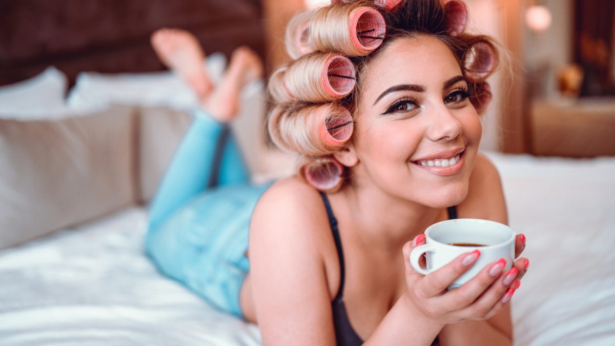 Beautiful Vintage Female With Hair Curlers And Her Cup Of Coffee